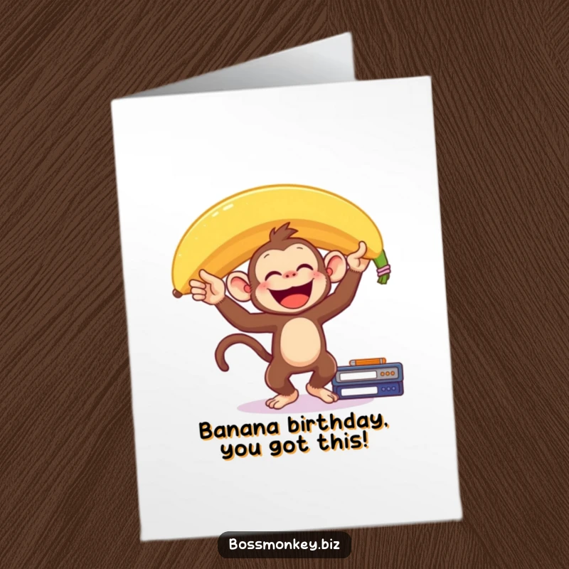 Funny Free Printable Birthday Card: Delighted monkey balances a giant banana on its head on a desk, celebrating joyfully.