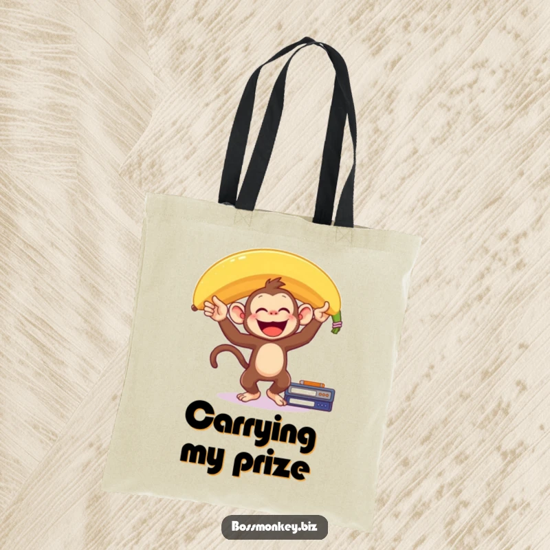 Funny Banana Monkey Tote Bag: A delighted monkey balances a giant banana on its head on a desk, humorously showcasing precarious fun.